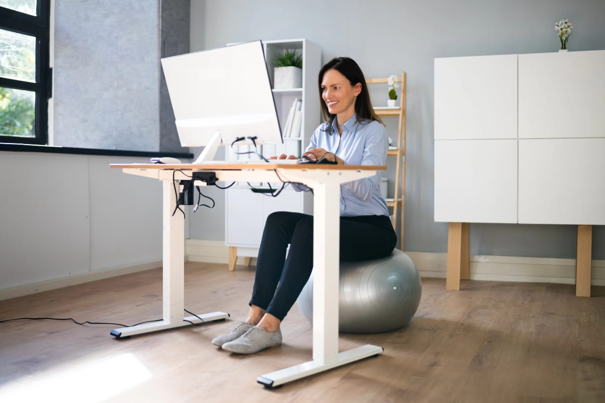 Ergonomic desk setup showing balance between sitting and standing.