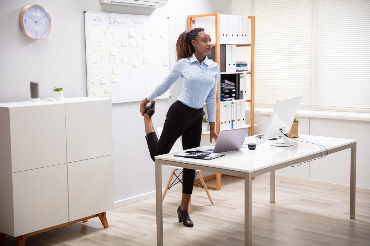 Is Standing Better Than Sitting? Finding the Right Balance at Work 5 Worker taking an active break to support comfort, posture and circulation.