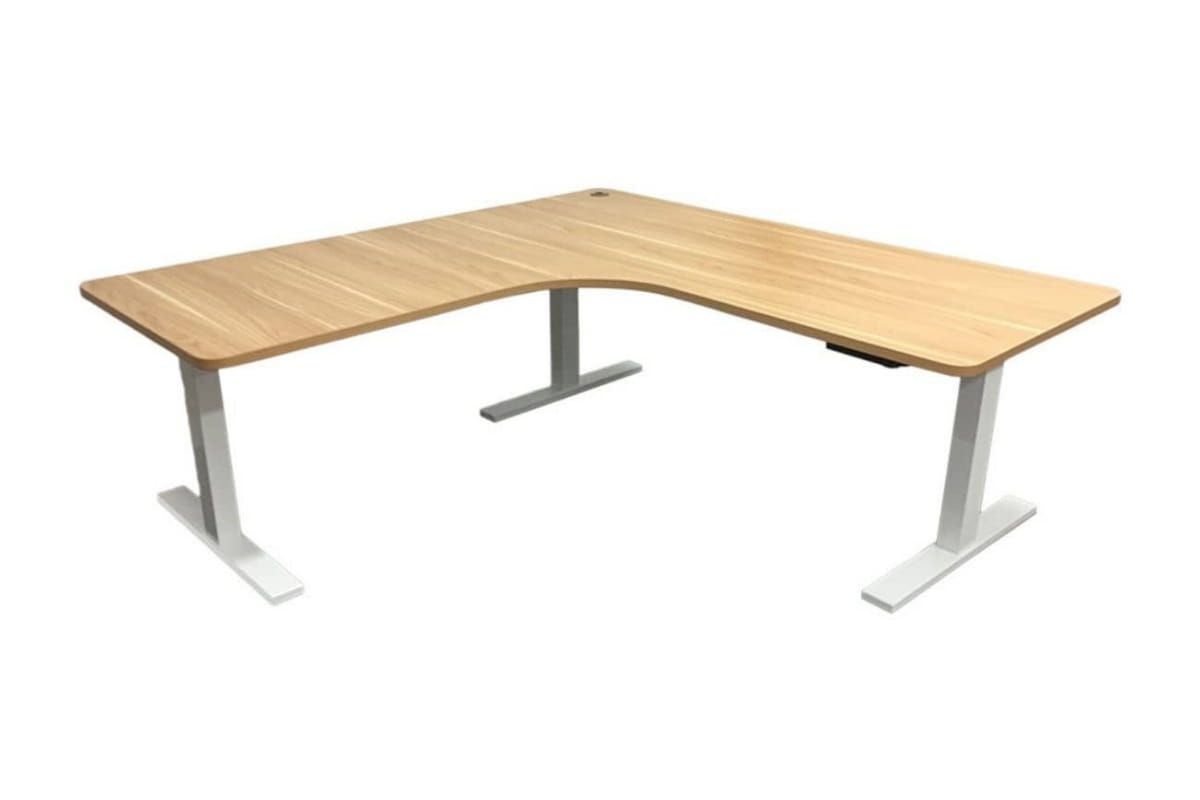 L-shaped sit-stand desk with a natural wood finish, ergonomic curved corner and spacious dual-sided work area.