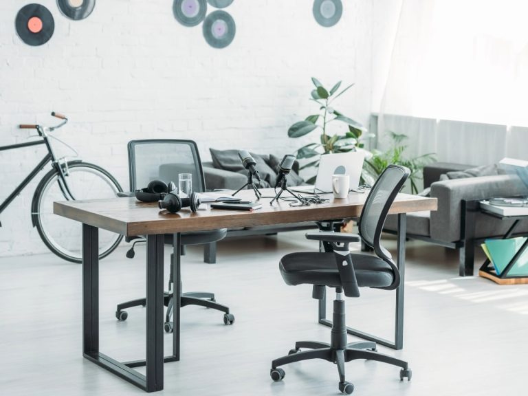 A stylish office setup with an ergonomic office chair in focus, demonstrating key features for office chair support including adjustable height and lumbar support.