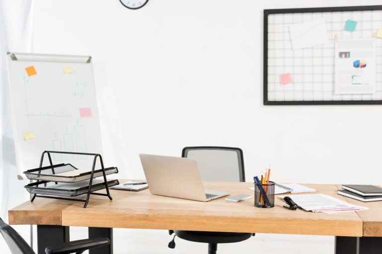 Clean office desk with ergonomic workspace example for the topic is standing better than sitting at work