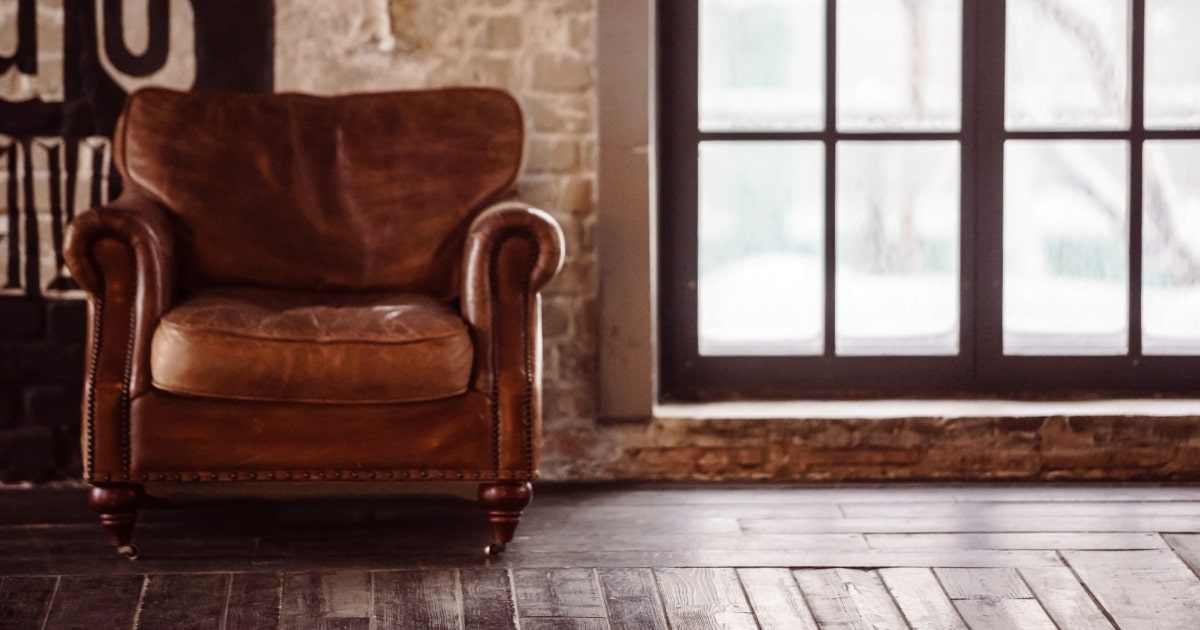 A brown leather arm chair never goes out of style.