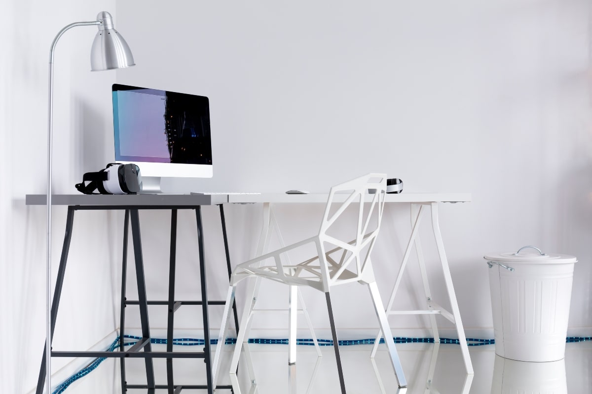 A minimalist, modern home office using black, white and chrome creates a sleek look.