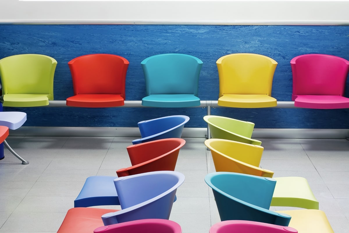 Brightly coloured beam seating, demonstrating the durable and easy-to-clean properties ideal for busy waiting rooms.